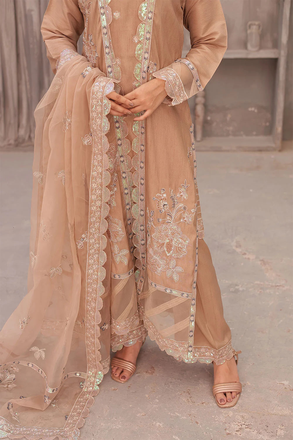 "Coral pink raw silk tunic, embroidered organza overcoat, wide‑leg trousers, and organza dupatta – premium stitched pret wear ensemble"