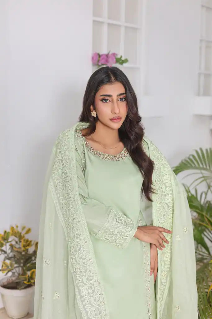 "Delicate embroidery on pistachio raw silk shirt – luxury stitched suit"