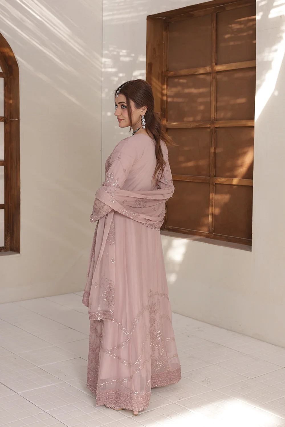 pink embroidered chiffon maxi style ensemble. Featuring a maxi shirt, silk plazzo trousers, and chiffon dupatta, perfect for weddings and luxury party wear