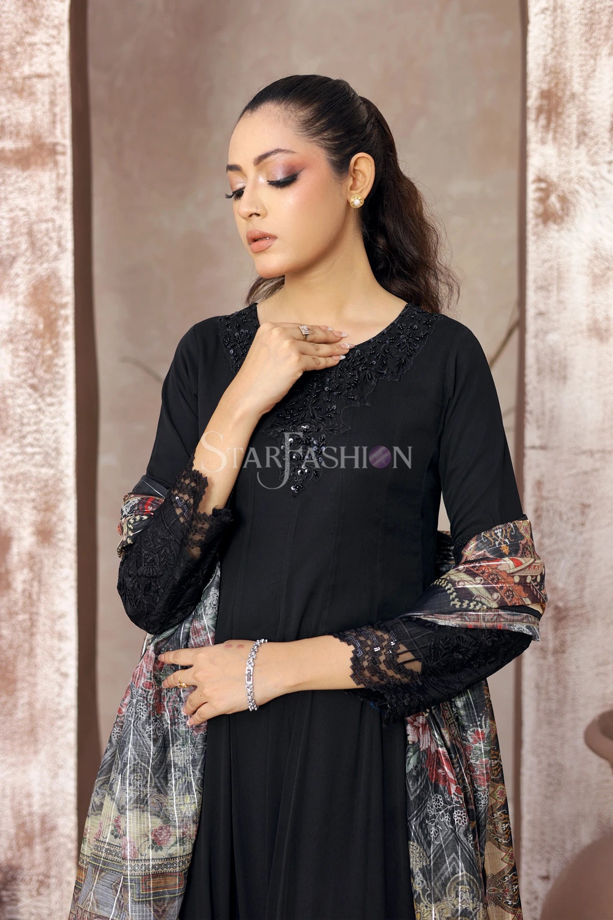 Command attention with Star Fashion’s embroidered black A‑line chiffon kurta ensemble, a 3‑piece stitched suit that blends timeless elegance with modern sophistication.