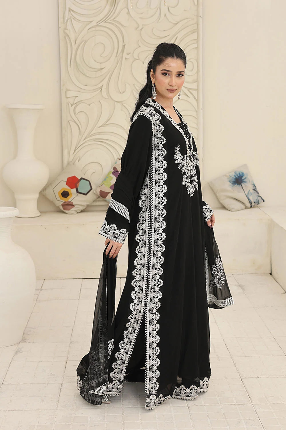 "Elegant black chiffon kaftan, straight‑fit trousers, and khaddi net dupatta – party wear ensemble"