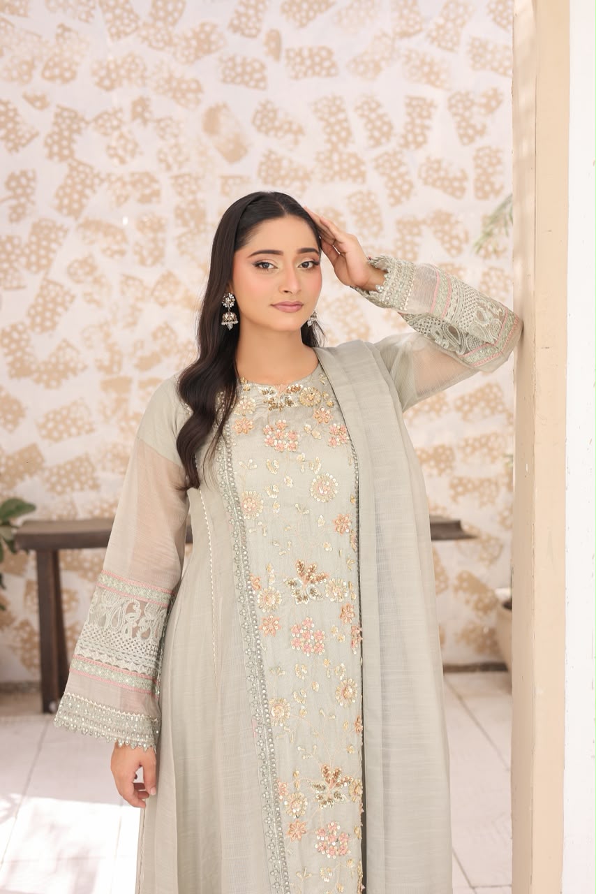 "Sea green 3-piece stitched embroidered suit with khaddi shirt, Russian silk koti, grip shalwar, and khaddi dupatta"