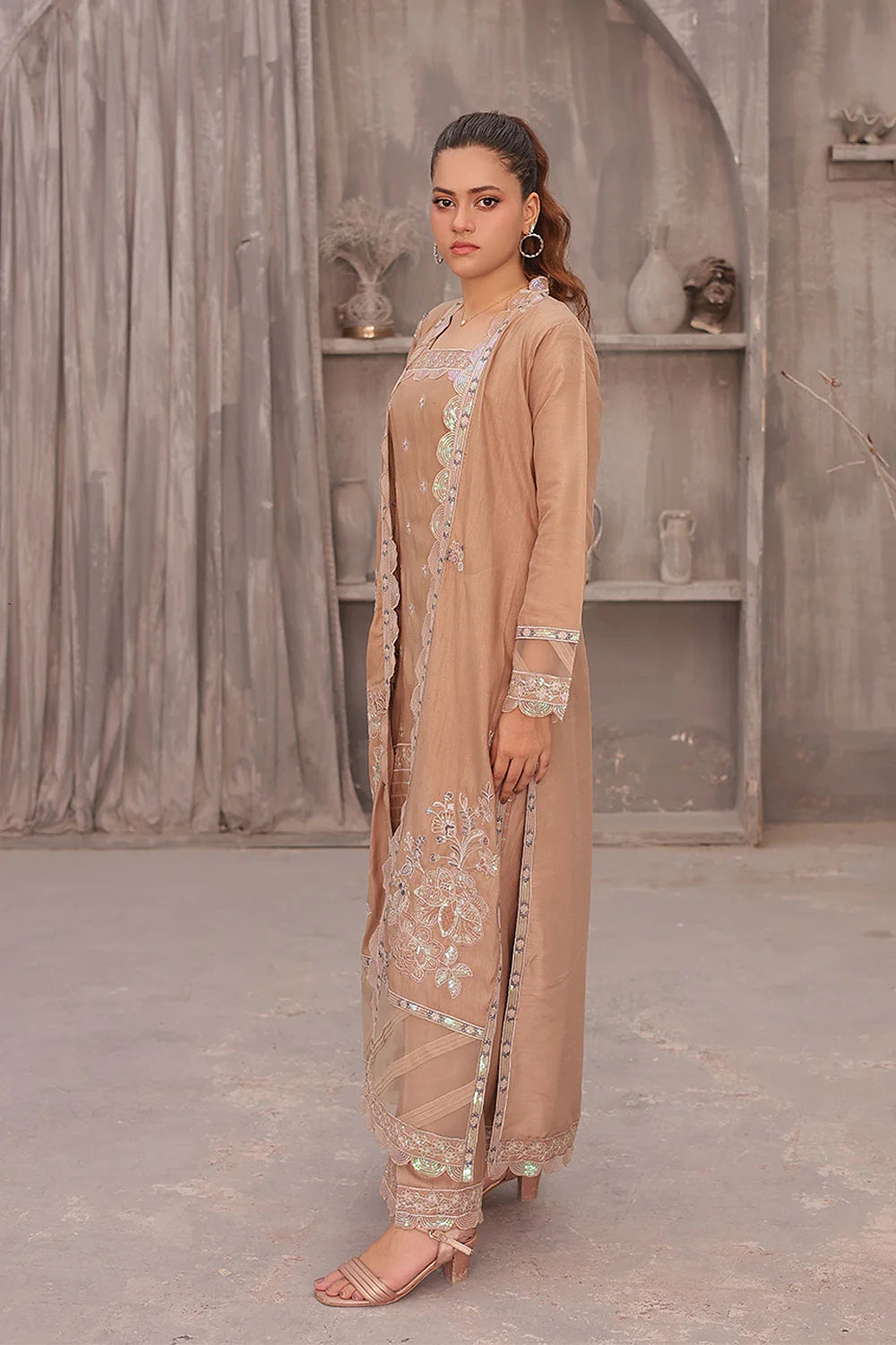 "Coral pink raw silk tunic, embroidered organza overcoat, wide‑leg trousers, and organza dupatta – premium stitched pret wear ensemble"