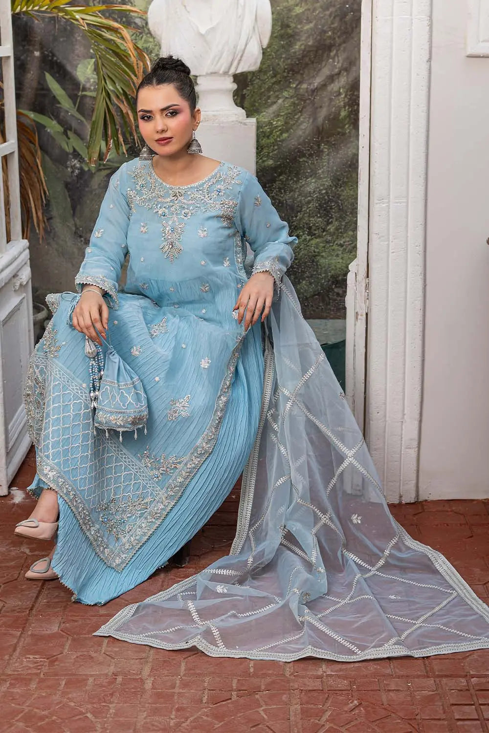 Baby blue embroidered 4-piece Pakistani suit featuring a silver-embellished organza coat, grip shirt and trousers, a soft Malai inner, and a matching organza dupatta