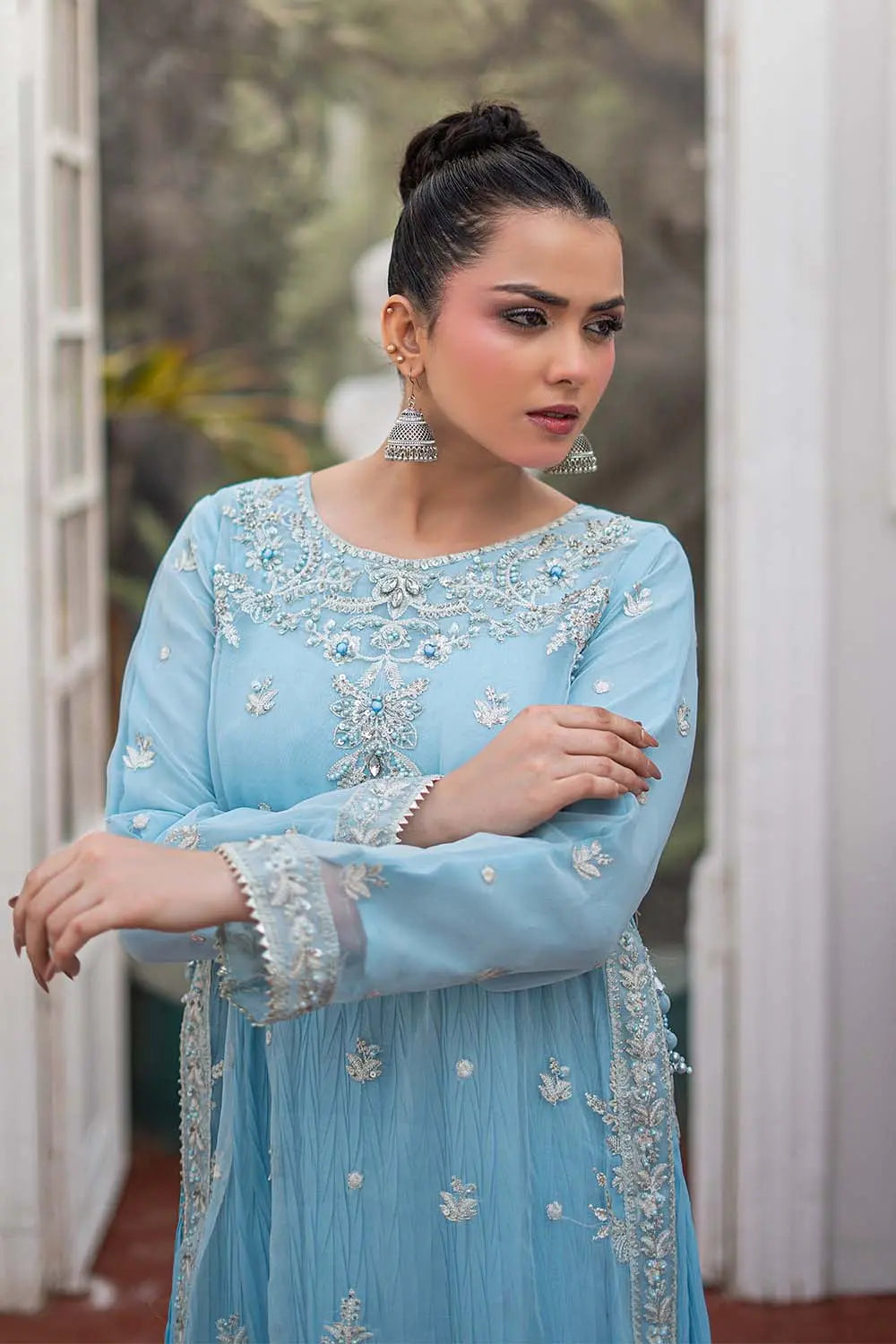 Baby blue embroidered 4-piece Pakistani suit featuring a silver-embellished organza coat, grip shirt and trousers, a soft Malai inner, and a matching organza dupatta
