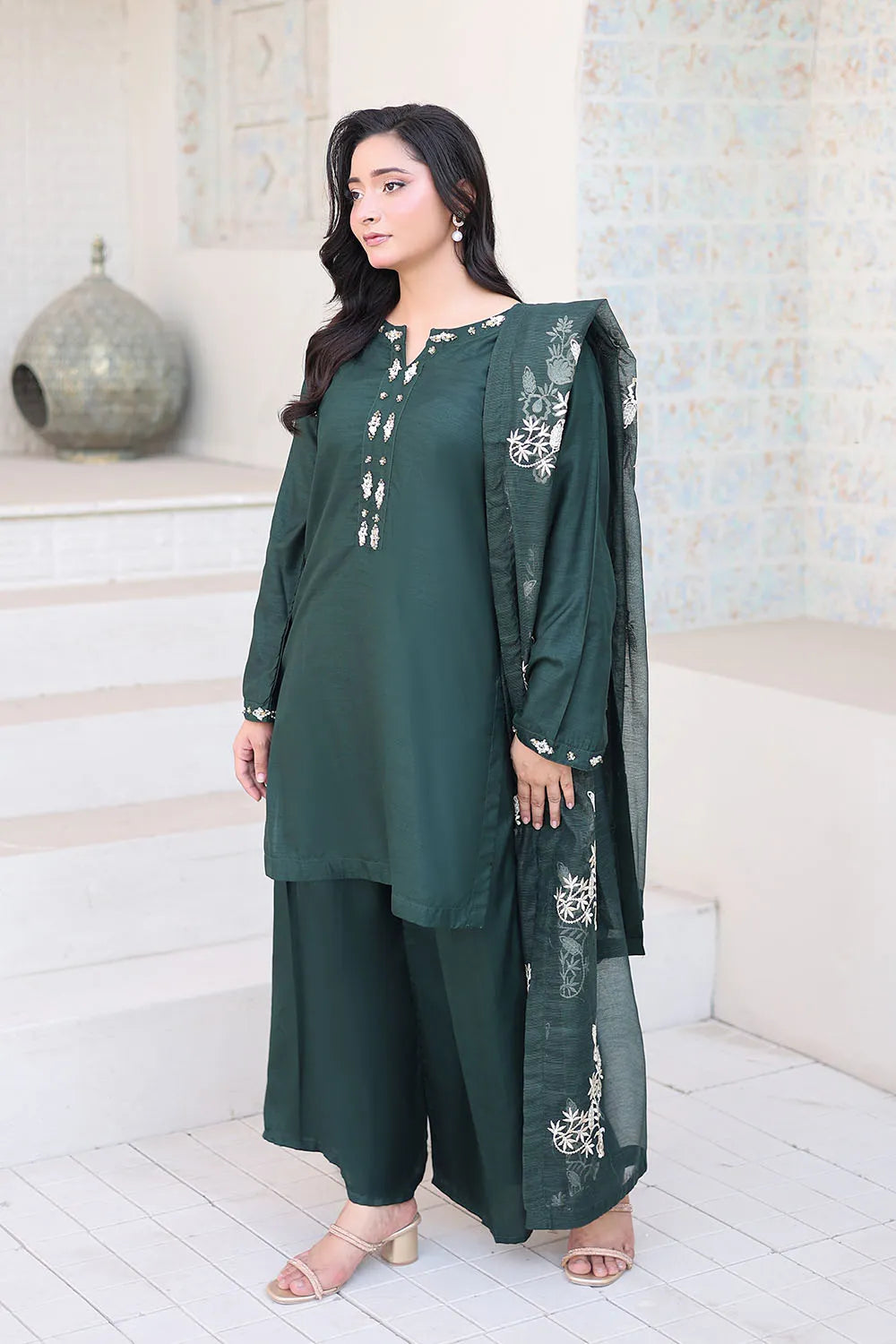 Bottle green embroidered 3-piece Pakistani suit featuring a short Russian silk shirt with full lining, matching Russian silk palazzo trousers, and a Khaddi Net dupatta.