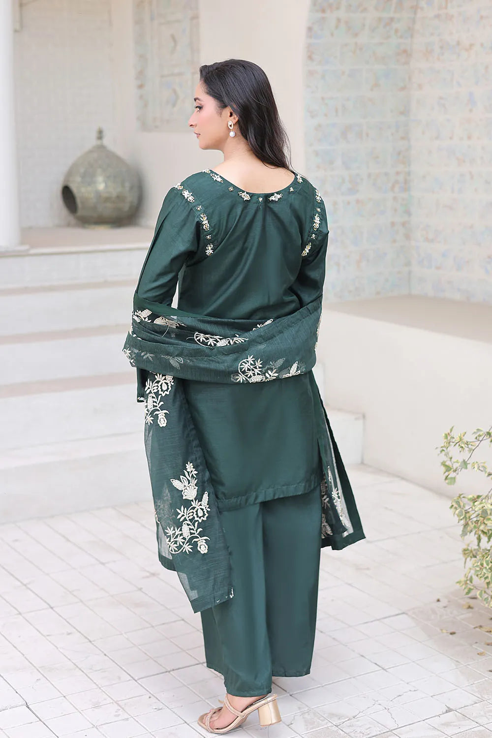 Bottle green embroidered 3-piece Pakistani suit featuring a short Russian silk shirt with full lining, matching Russian silk palazzo trousers, and a Khaddi Net dupatta.