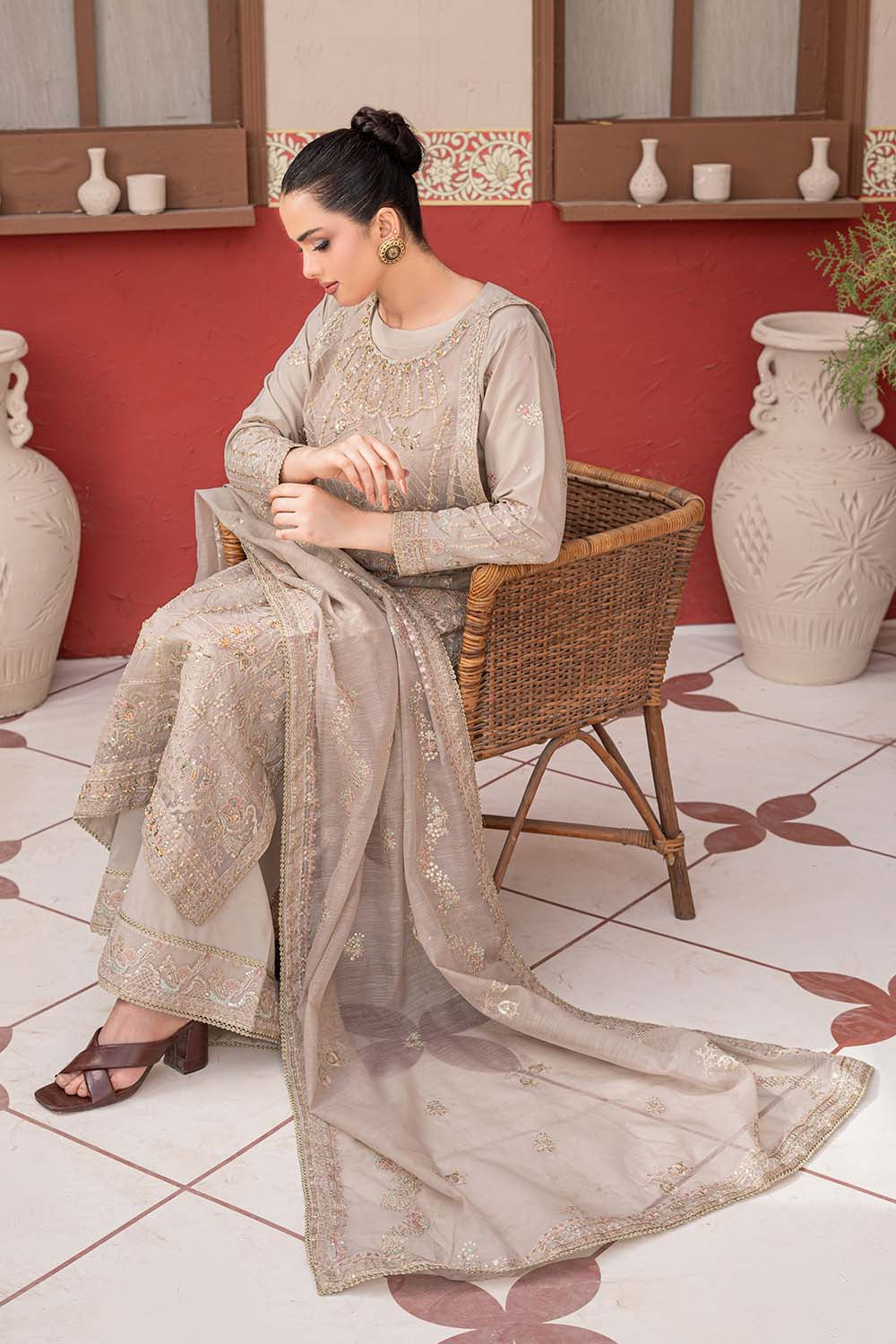 Fawn beige embroidered 4-piece Pakistani suit featuring a Khadi Net coat, Grip inner, matching Grip trousers, and embroidered Khadi Net dupatta