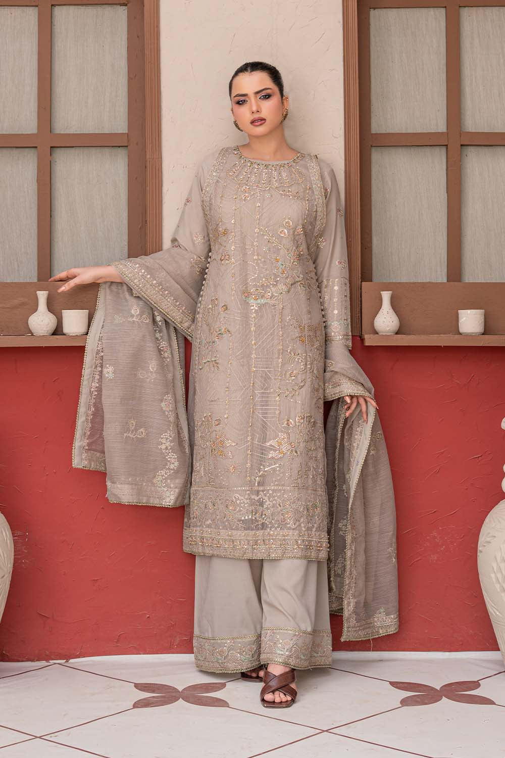 Fawn beige embroidered 4-piece Pakistani suit featuring a Khadi Net coat, Grip inner, matching Grip trousers, and embroidered Khadi Net dupatta