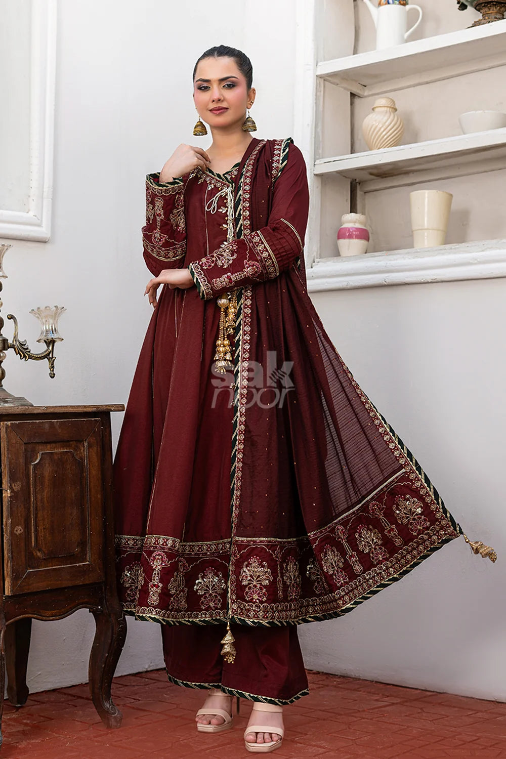 Maroon embroidered 3-piece Pakistani suit featuring a Shamus silk Angrakha frock with full Malai lining, matching Shamus silk palazzo trousers, and a self-Khaddi dupatta