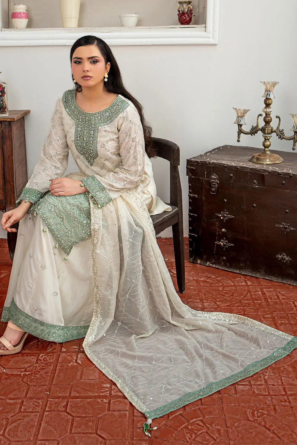 Off-white embroidered 3-piece Pakistani suit featuring a short Bana Dora kurta with Malai lining, matching Kali palazzo, and Khaddi Net dupatta