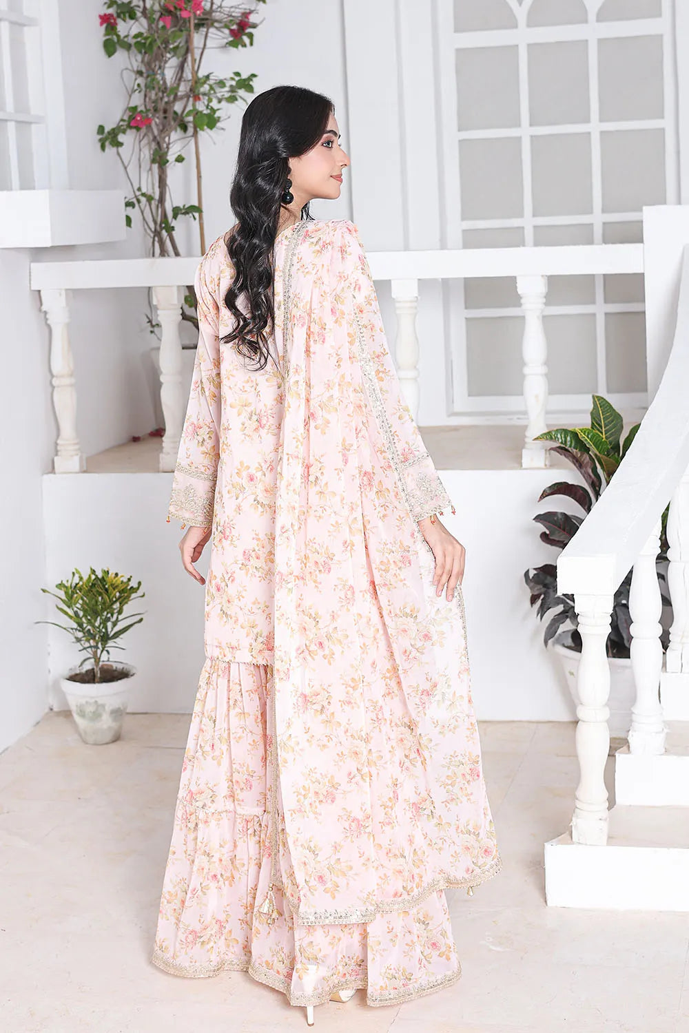 Peach embroidered 3-piece Pakistani suit featuring a printed chiffon short shirt with full lining, straight-leg printed chiffon gharara with attached lining, and matching printed chiffon dupatta.