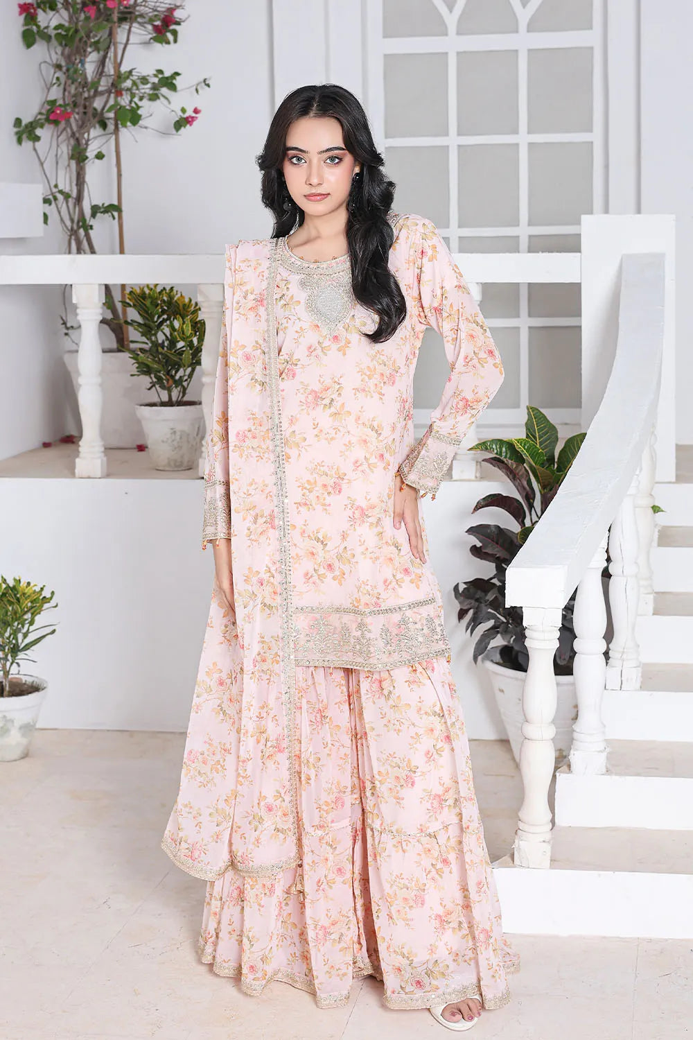Peach embroidered 3-piece Pakistani suit featuring a printed chiffon short shirt with full lining, straight-leg printed chiffon gharara with attached lining, and matching printed chiffon dupatta.