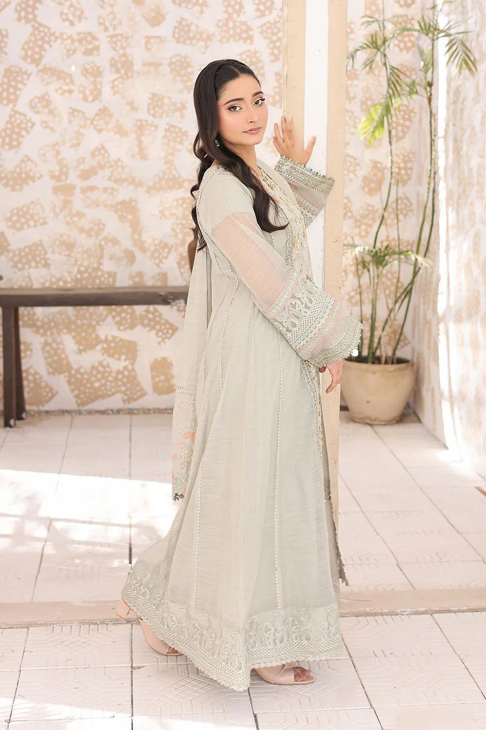 Pistachio three-piece embroidered frock featuring Khaddi Net fabric, full lining, Crepe straight trousers, and a matching Khaddi Net dupatta.