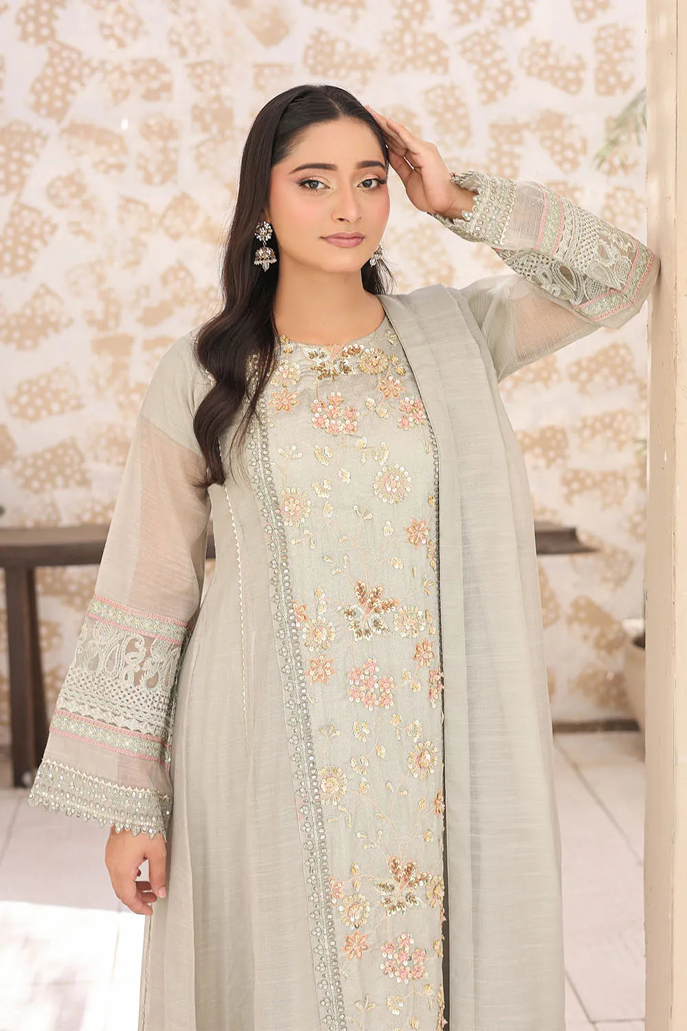 Pistachio three-piece embroidered frock featuring Khaddi Net fabric, full lining, Crepe straight trousers, and a matching Khaddi Net dupatta.