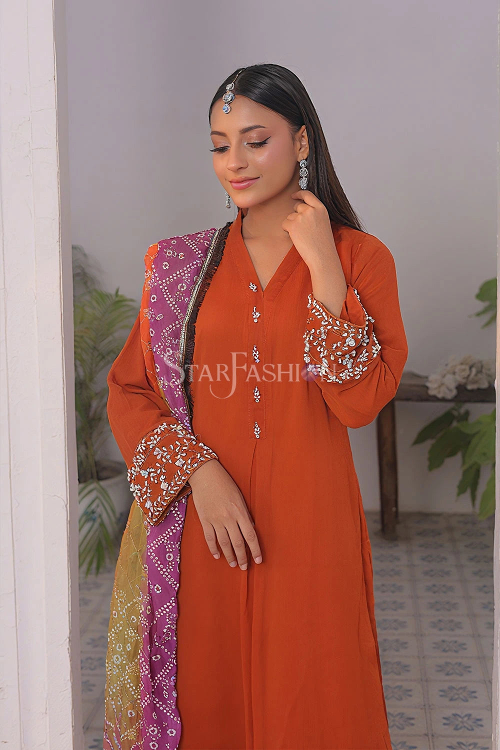 Close-up of embroidery on rust chiffon frock – SF-2348.