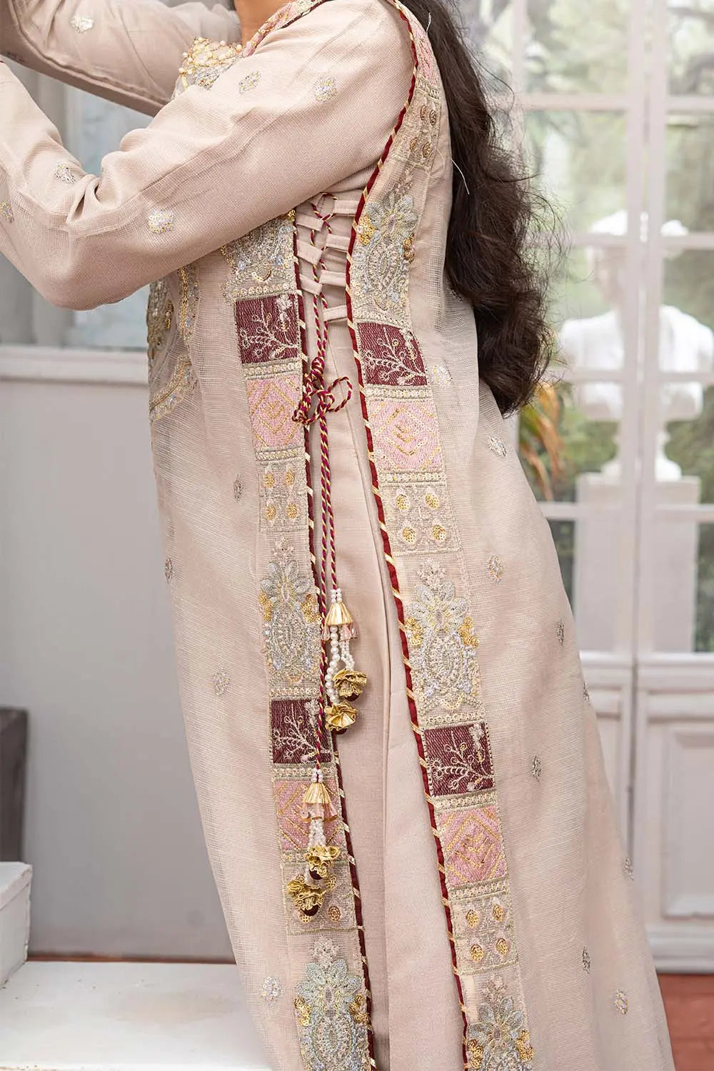 Taupe embroidered 4-piece Pakistani suit featuring a side dori style Khaddi Net overcoat with full lining, raw silk palazzo trousers, and a matching Khaddi Net dupatta.