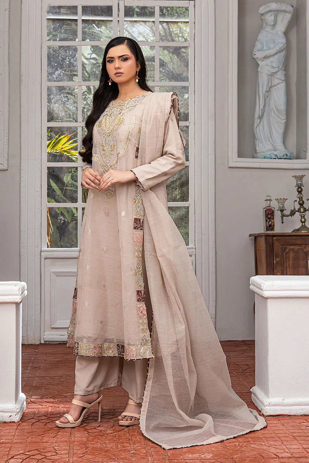 Taupe embroidered 4-piece Pakistani suit featuring a side dori style Khaddi Net overcoat with full lining, raw silk palazzo trousers, and a matching Khaddi Net dupatta.