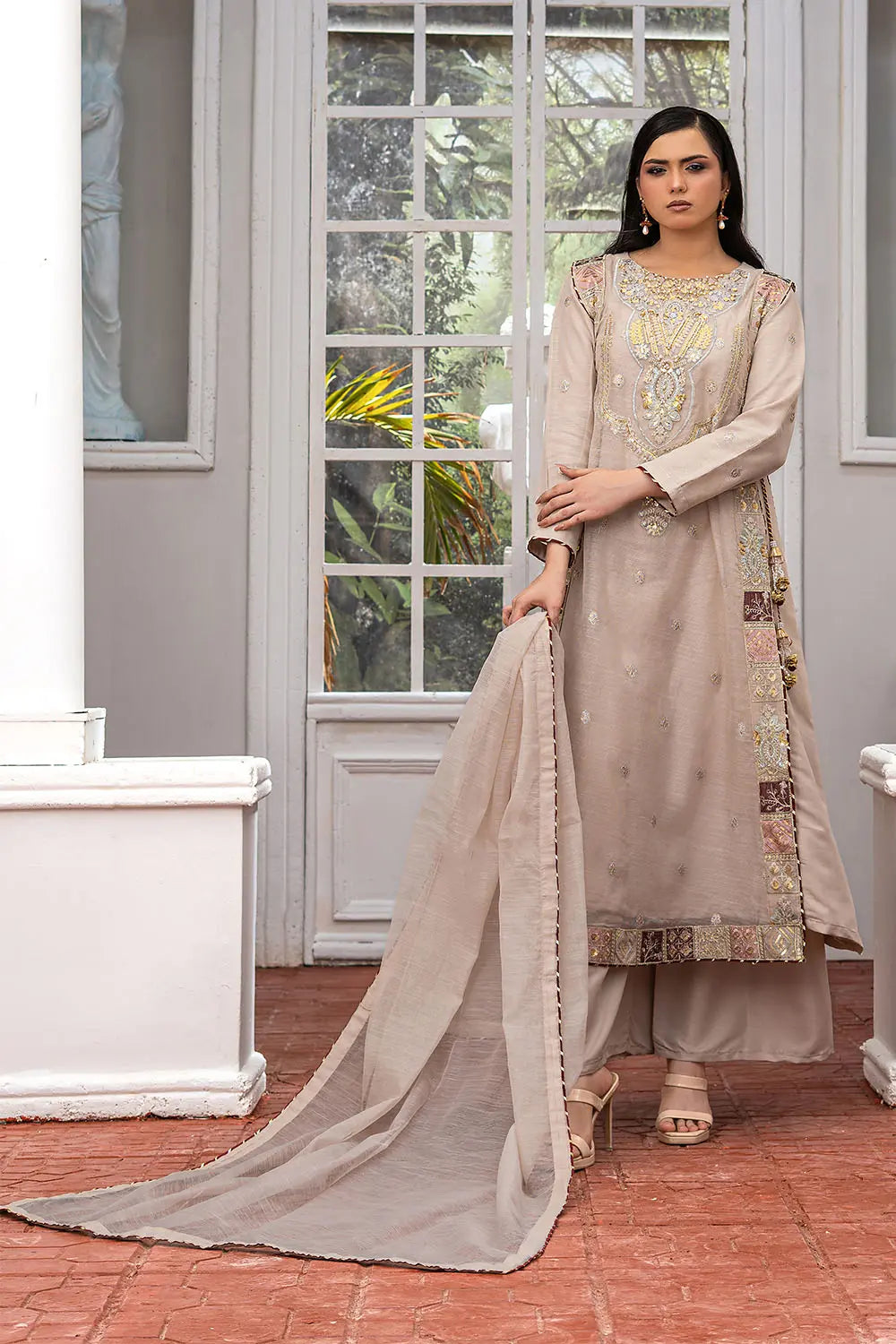 Taupe embroidered 4-piece Pakistani suit featuring a side dori style Khaddi Net overcoat with full lining, raw silk palazzo trousers, and a matching Khaddi Net dupatta.