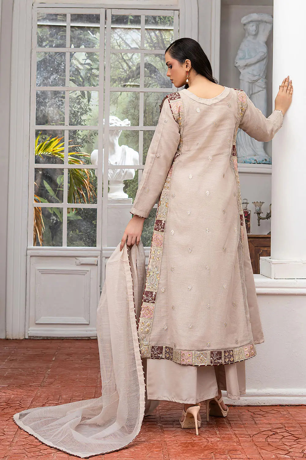Taupe embroidered 4-piece Pakistani suit featuring a side dori style Khaddi Net overcoat with full lining, raw silk palazzo trousers, and a matching Khaddi Net dupatta.