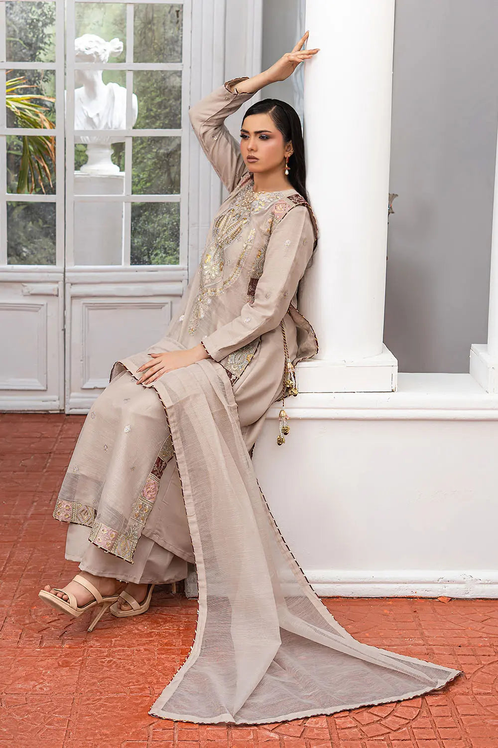Taupe embroidered 4-piece Pakistani suit featuring a side dori style Khaddi Net overcoat with full lining, raw silk palazzo trousers, and a matching Khaddi Net dupatta.