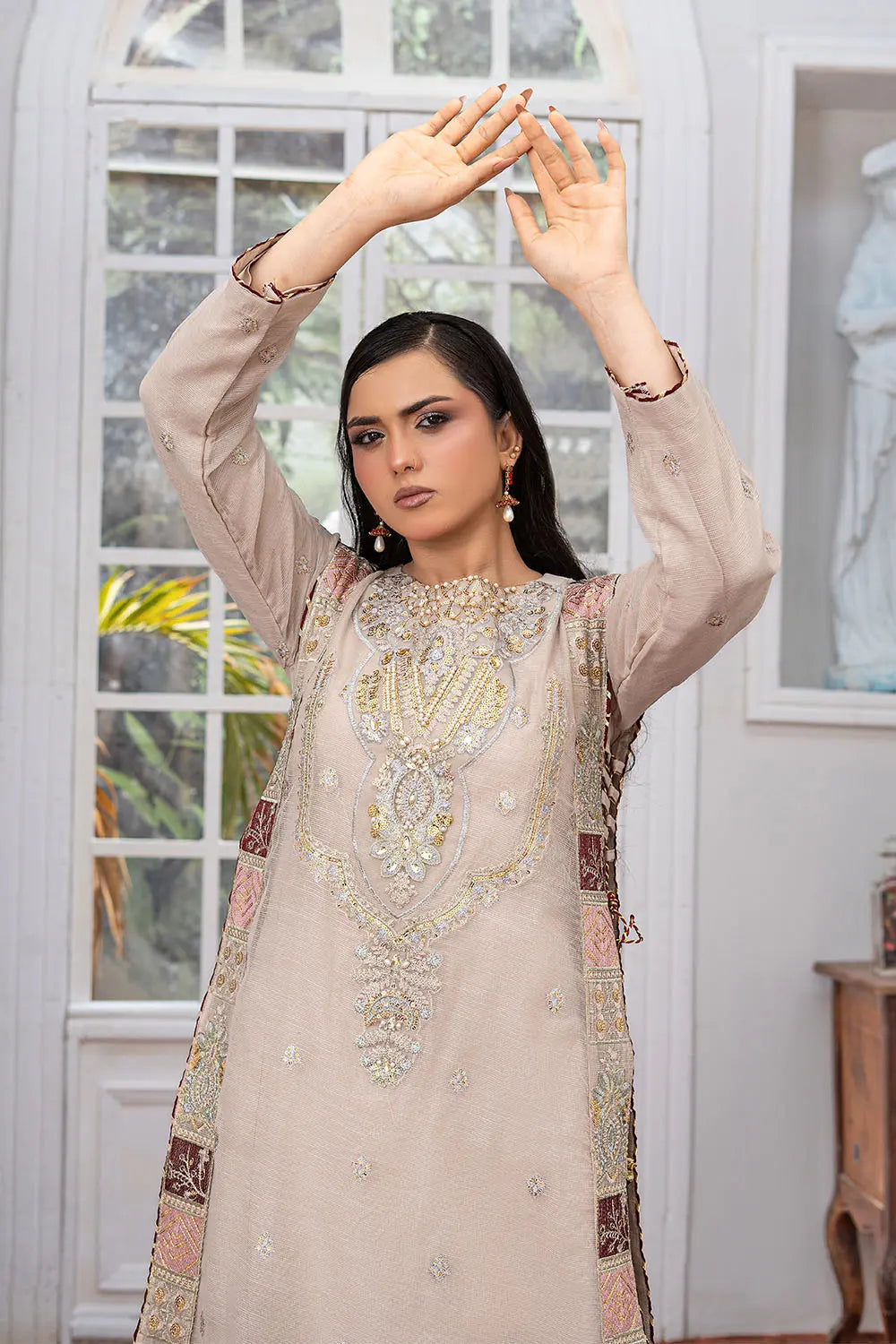 Taupe embroidered 4-piece Pakistani suit featuring a side dori style Khaddi Net overcoat with full lining, raw silk palazzo trousers, and a matching Khaddi Net dupatta.